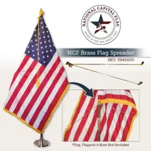 Brass flag spreader holding an indoor flag fully extended