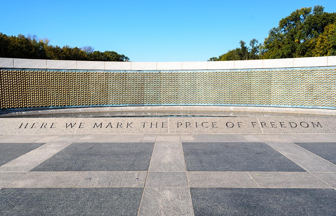 The World War II Memorial in Washington, DC, inscribed Here We Mark The Price Of Freedom