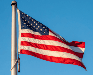 American flag with reinforced header and brass grommets for outdoor flagpoles American flag with reinforced header and brass grommets for outdoor flagpoles
