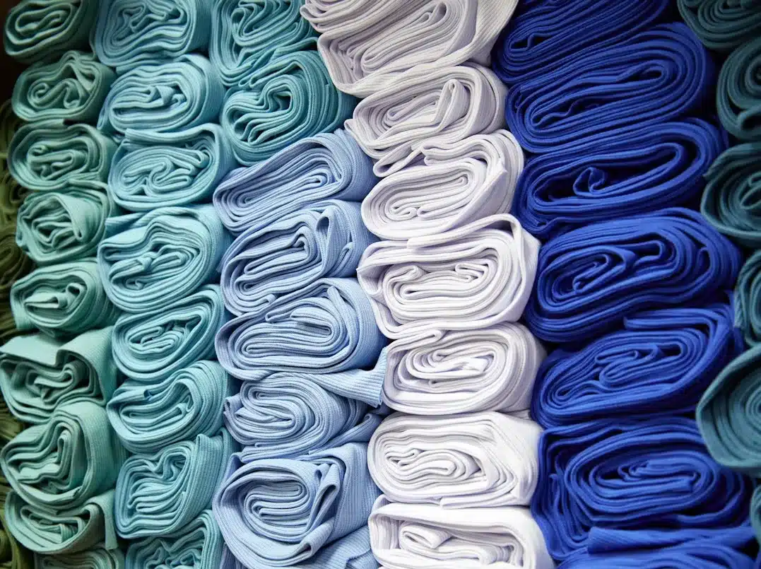 White and various shades of blue folded cloths