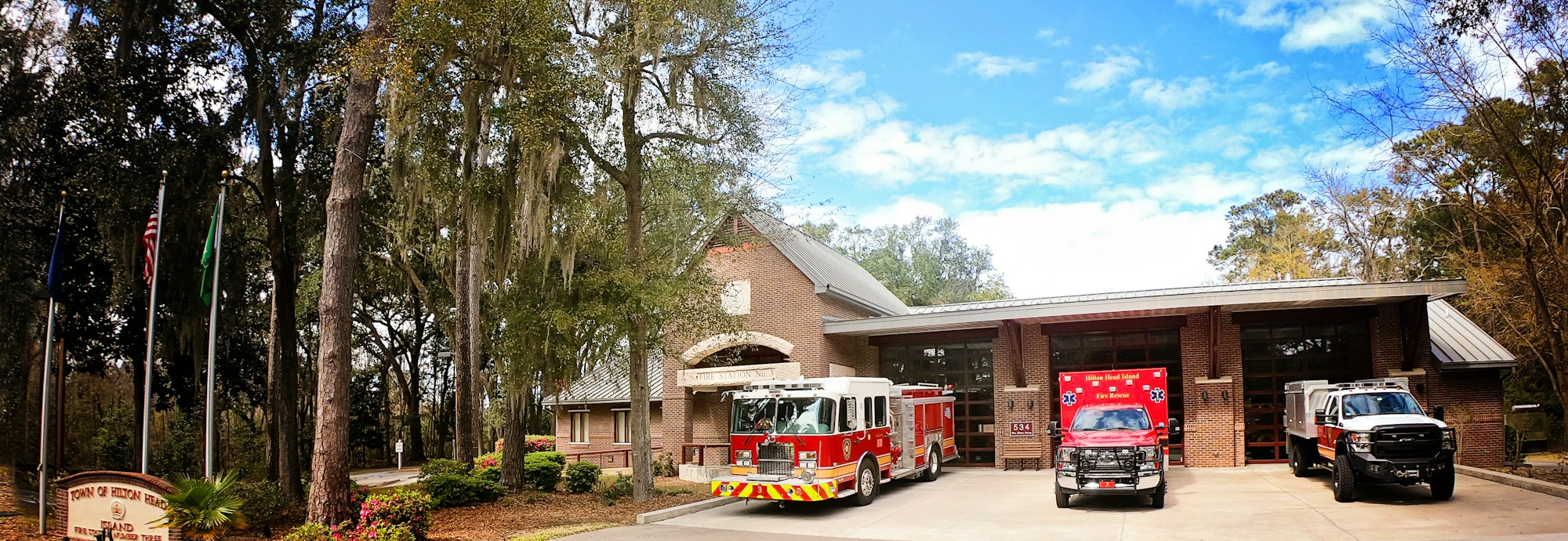 American and state flags flying at a fire station, one of the organizations National Capital Flag sets up with business accounts
